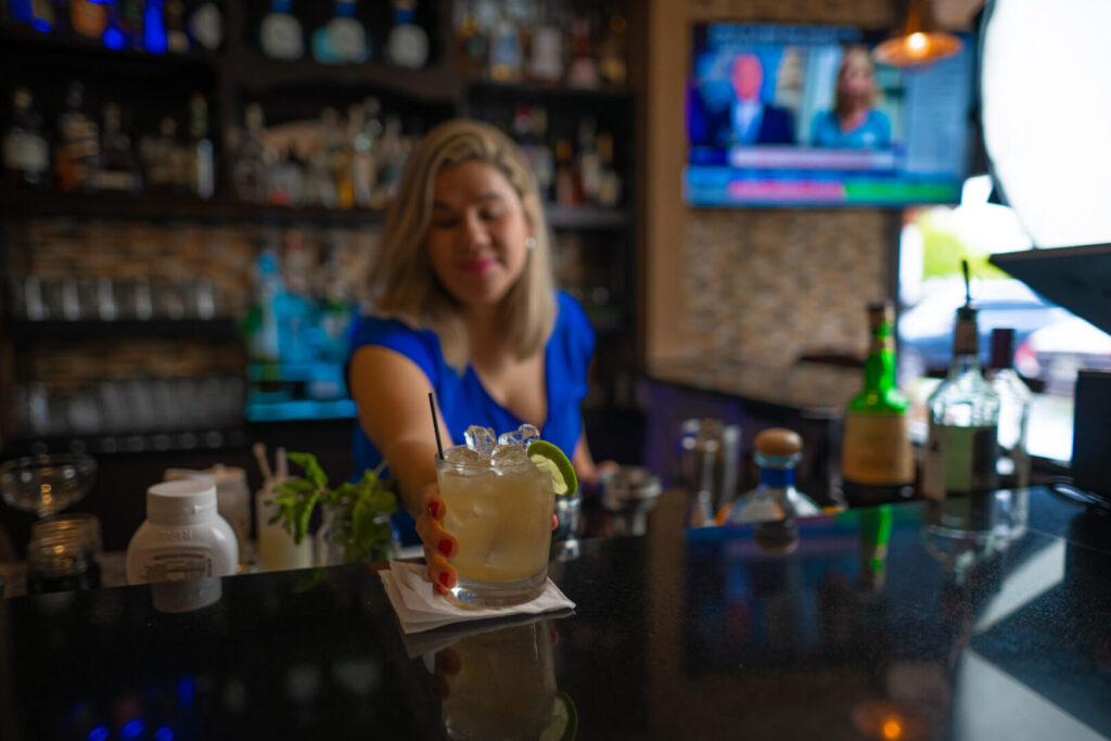 serving refreshing cocktail drinks at Espositos Pizza Bar and Restaurant
